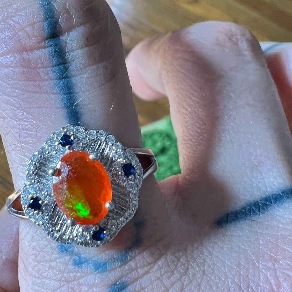 Stunning NEW large orange gemstone with blue and clear stones around it